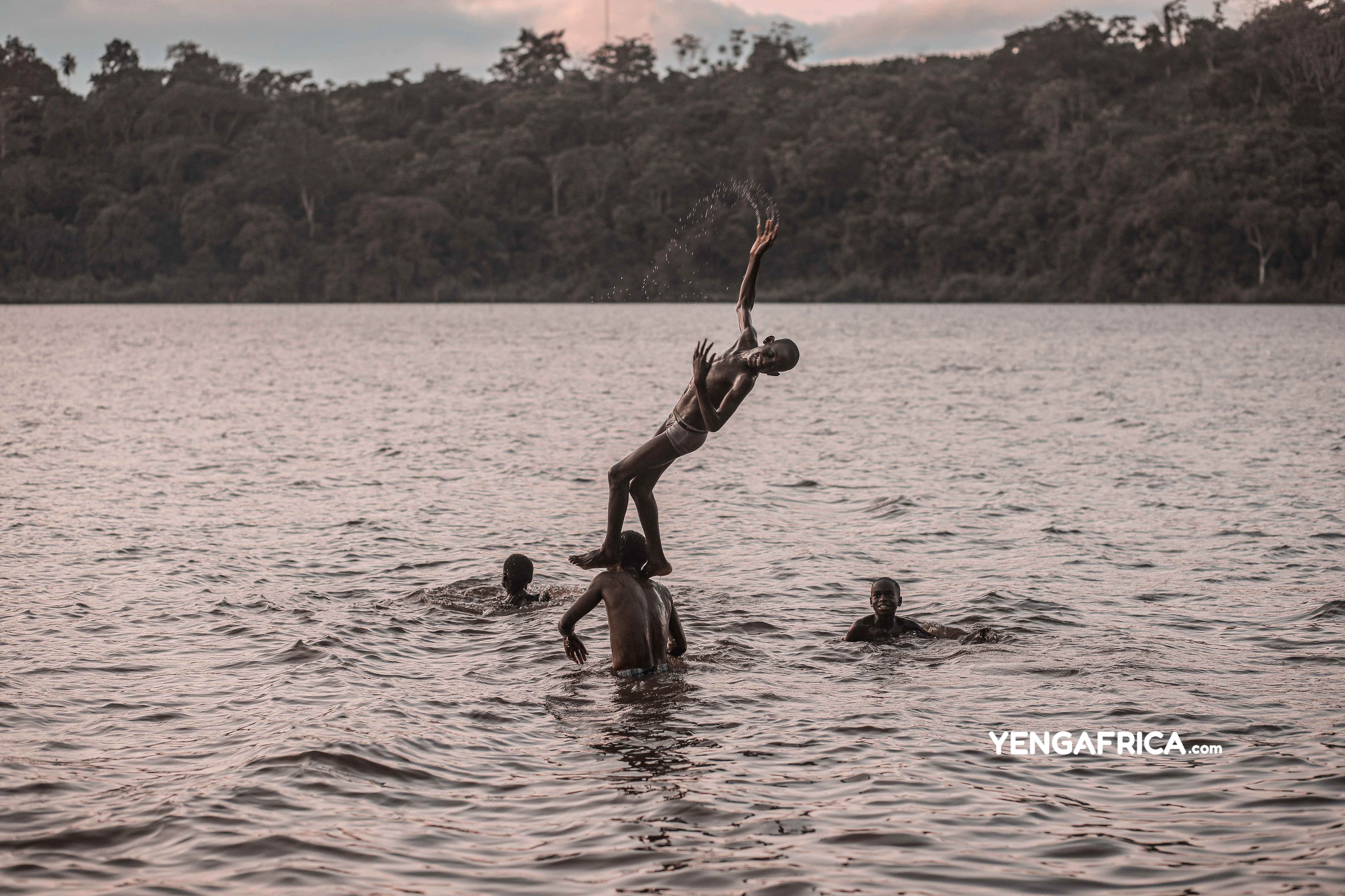 Kids playing after school in Lake Ossa, Dizangue.