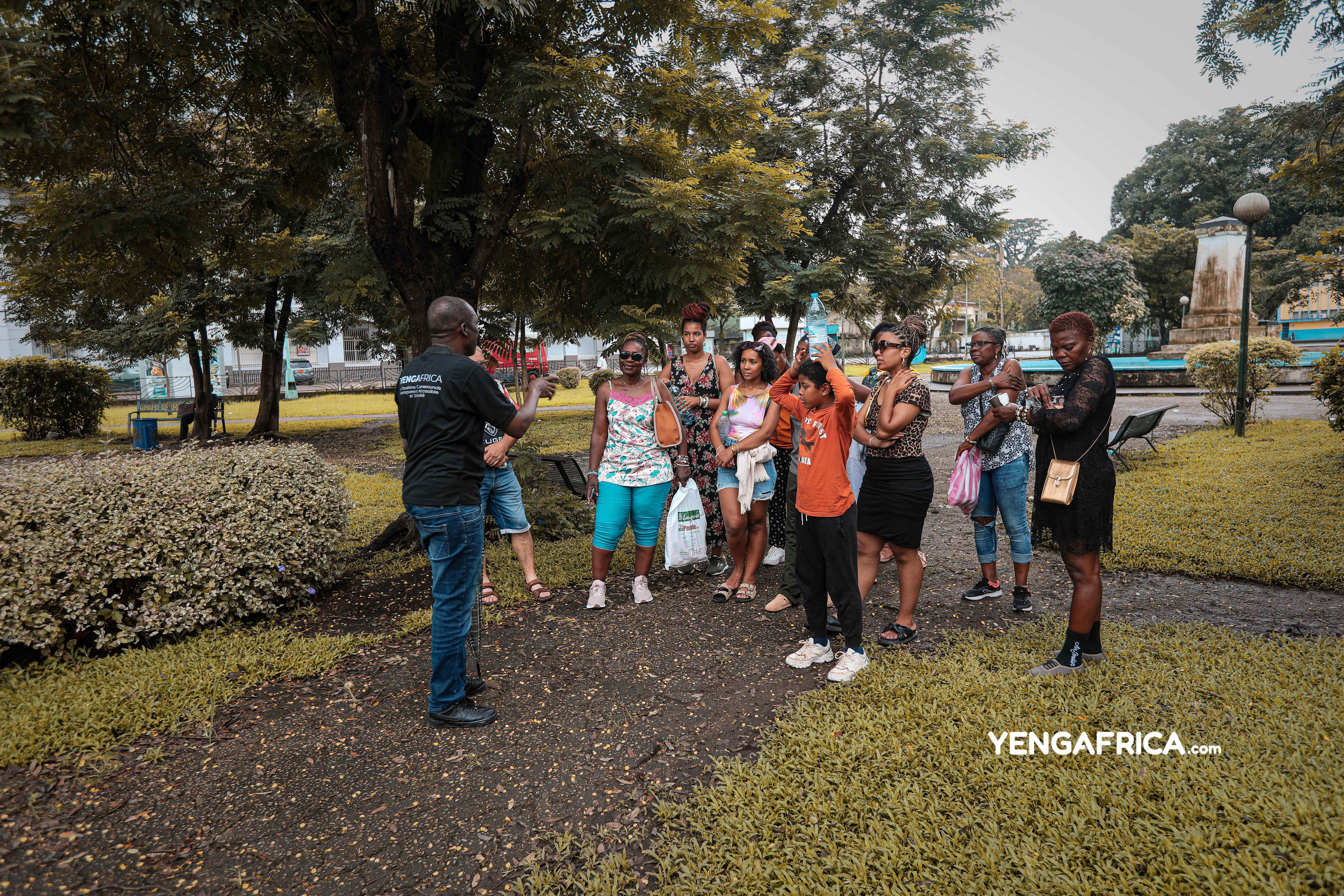 Family with kids on a guided Douala walking city tour in Bonanjo. - YENGAFRICA