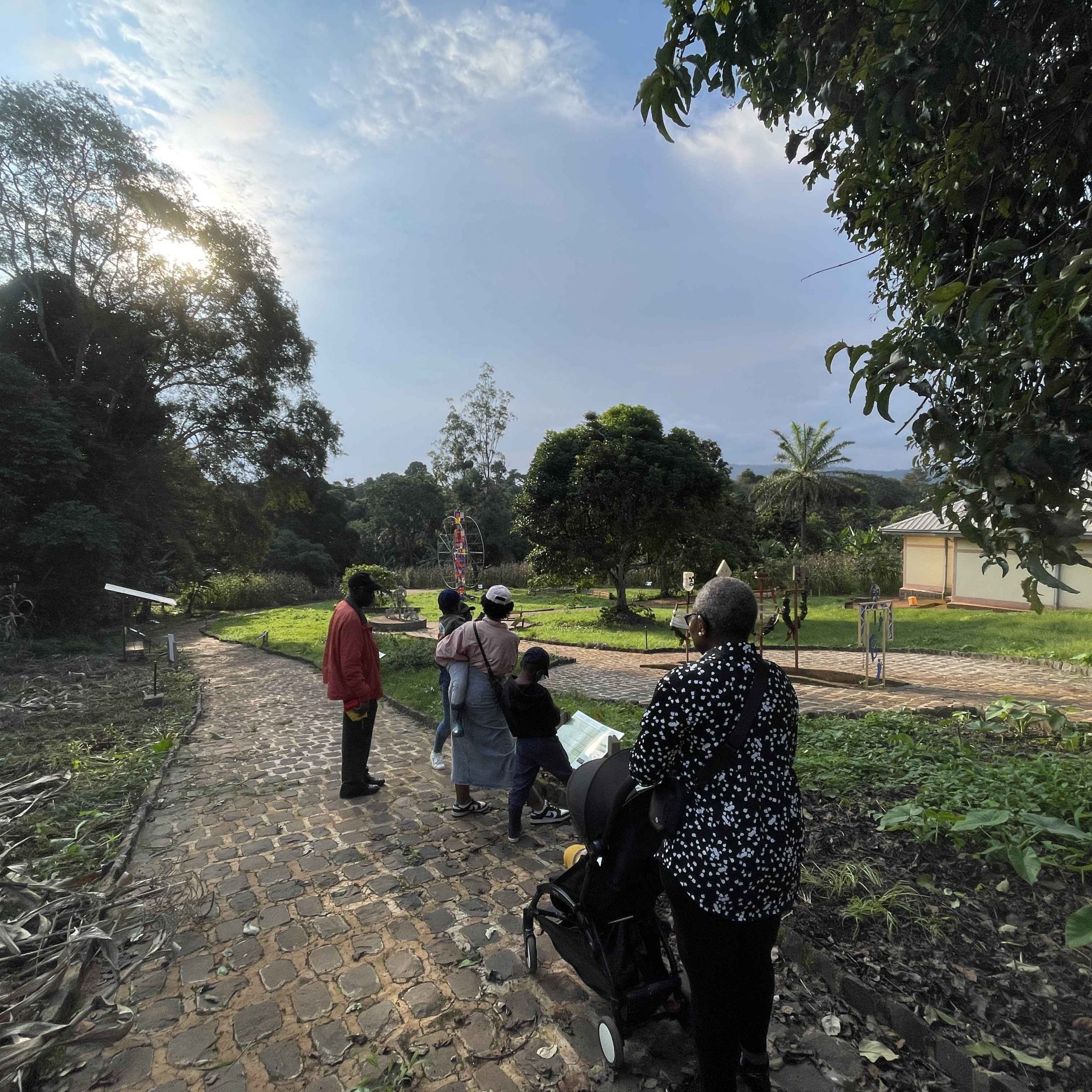 Family having a guided tour of the bangou slave trade market site